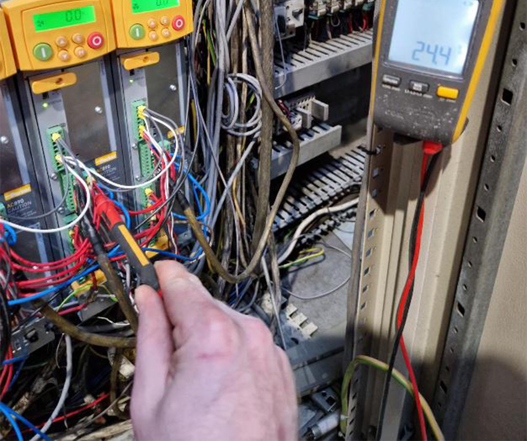 Electrician testing a fusebox